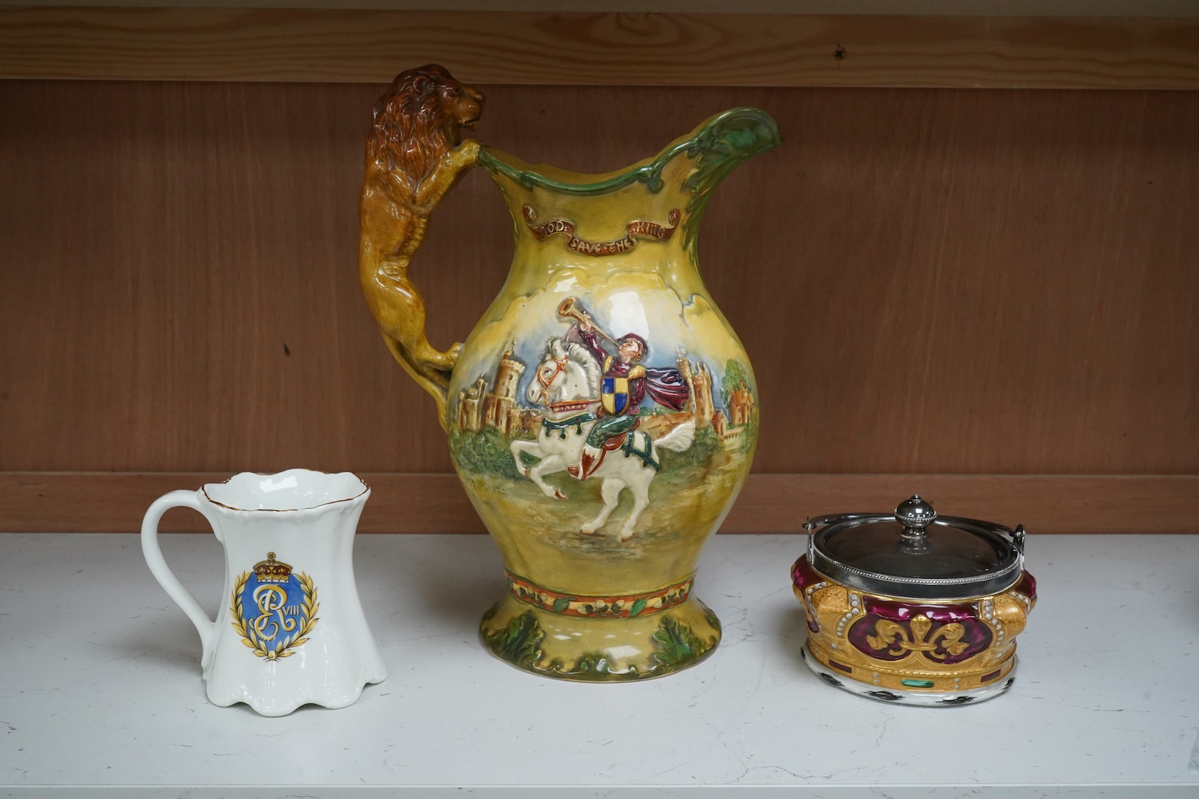 A Crown Devon George VI musical coronation jug, a crown shaped jar with plated cover and a coronation cup, largest 32cm high